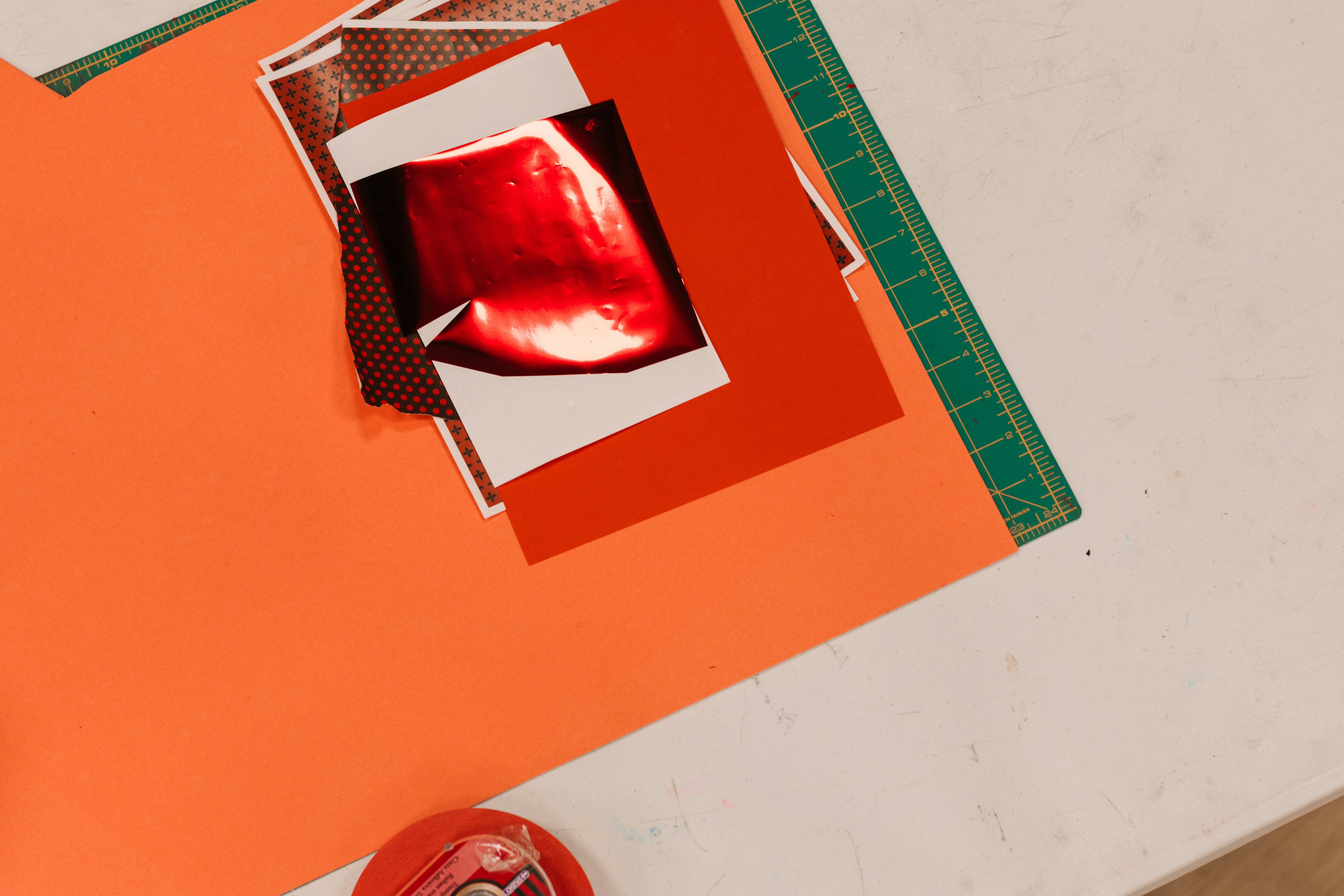 Close-up of red lips on collage materials