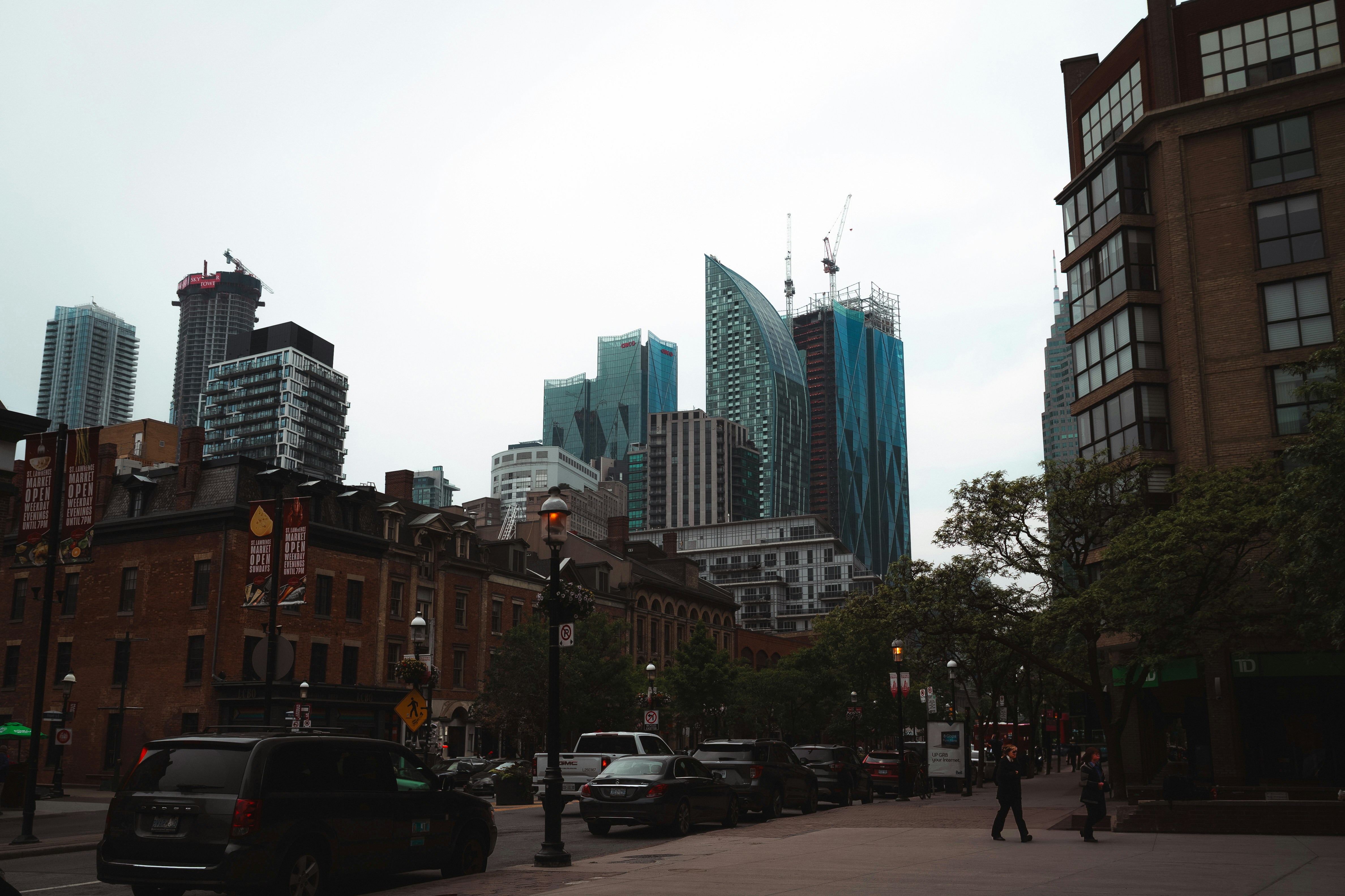 Modern skyscrapers rise above historic city buildings.
