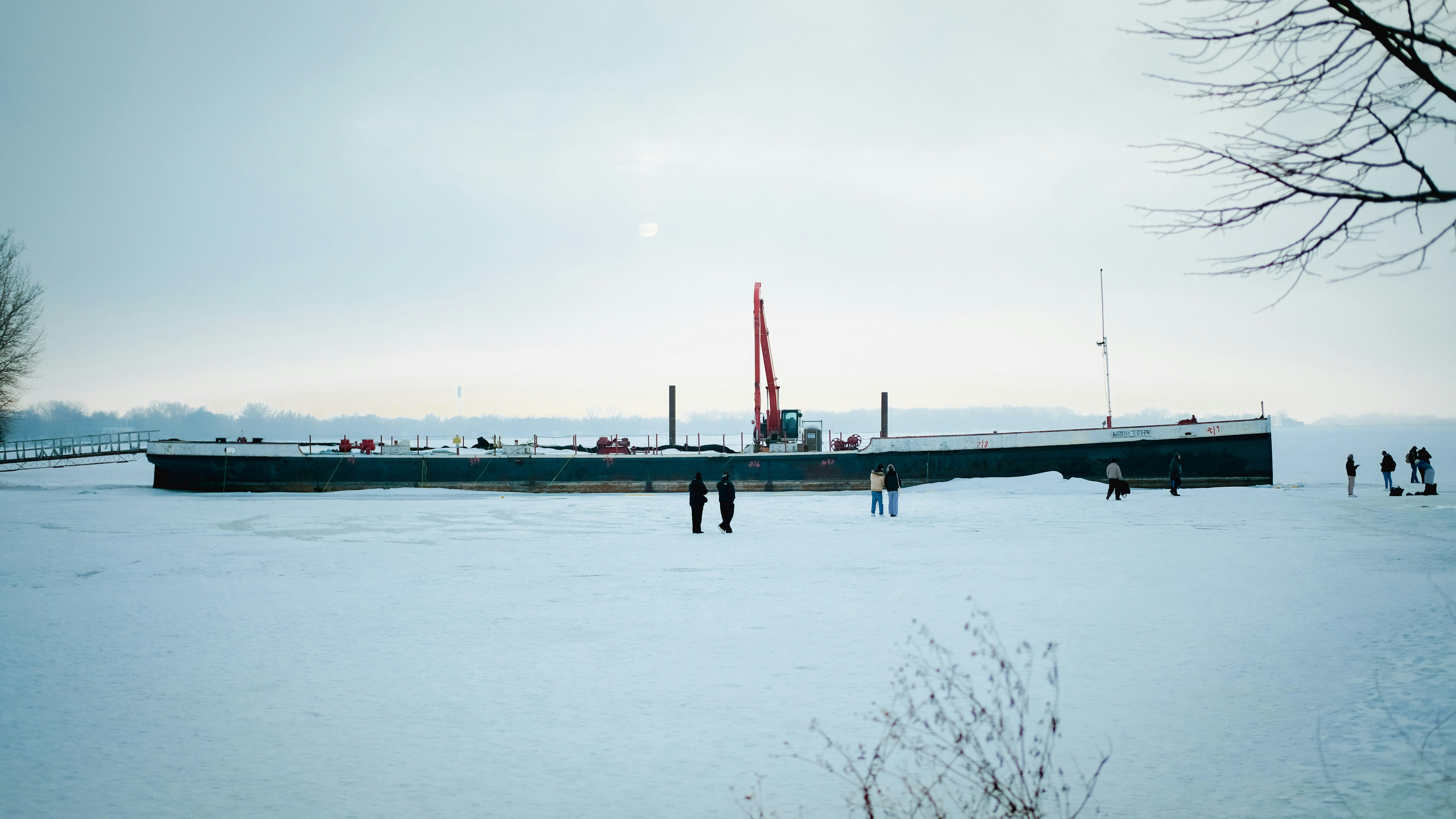 Ship on a frozen body of water with people