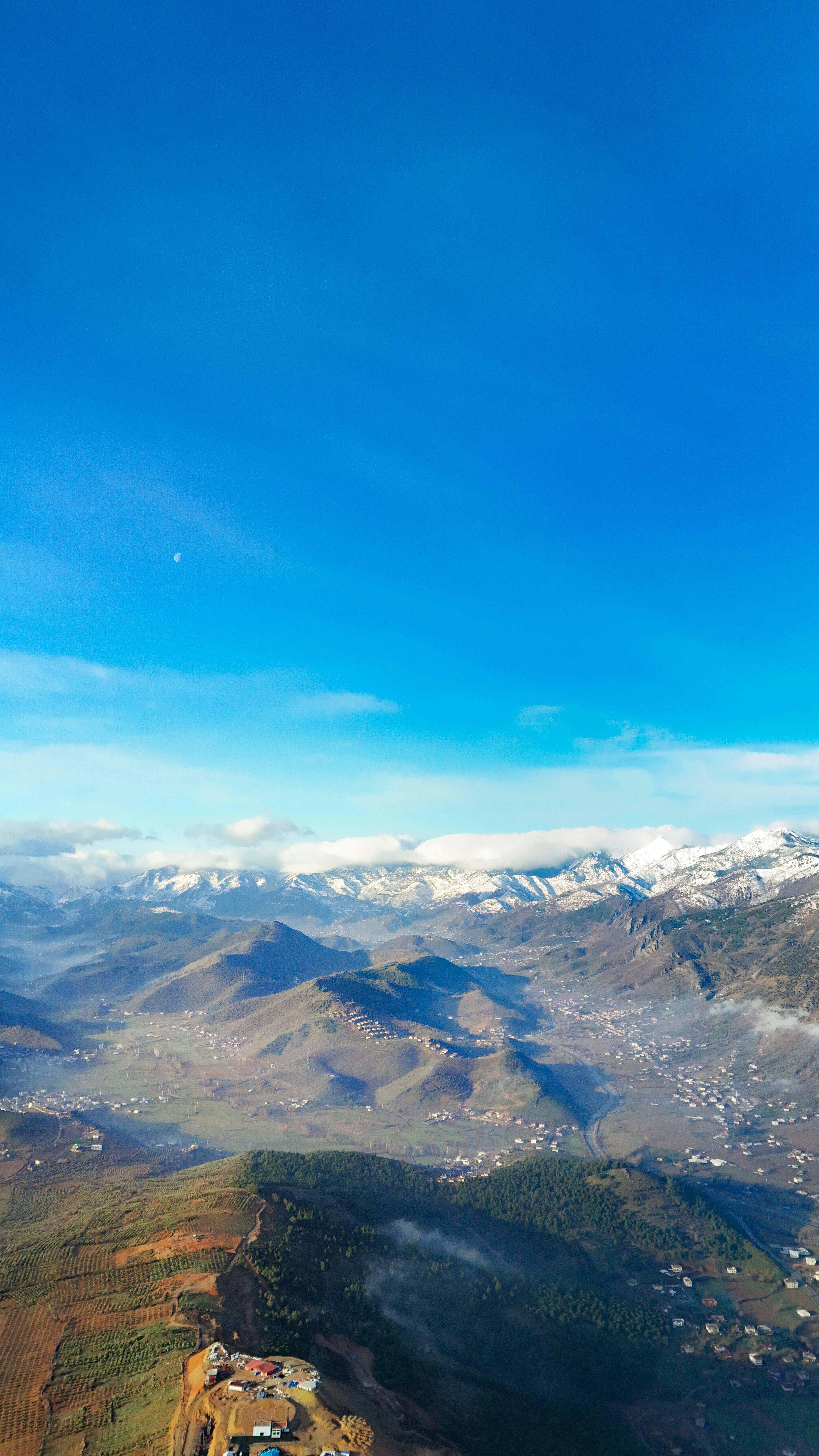 Snow-capped mountains under a clear blue sky.