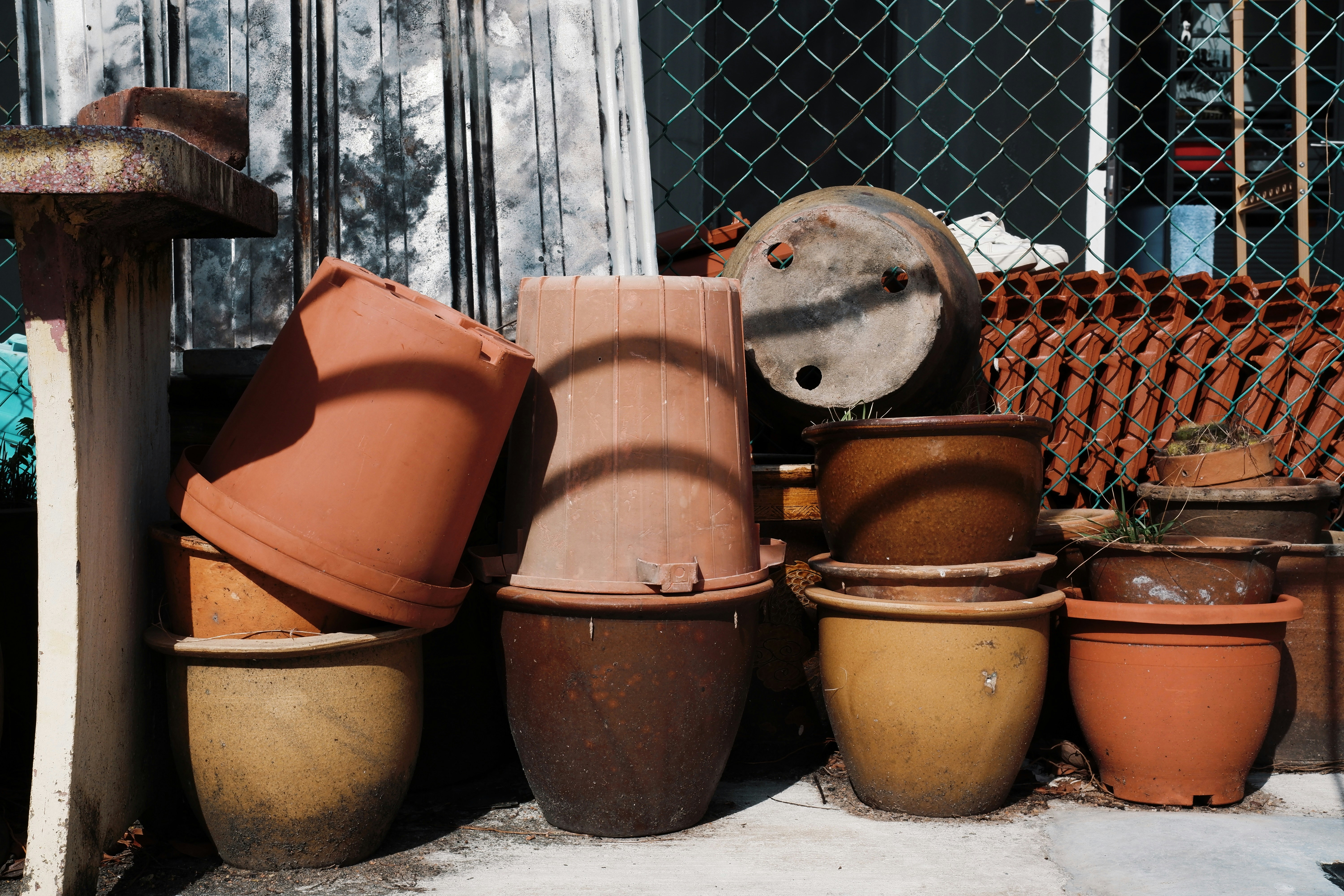 Gardening tools and shallow ceramic pots ready for planting - succulent bowl