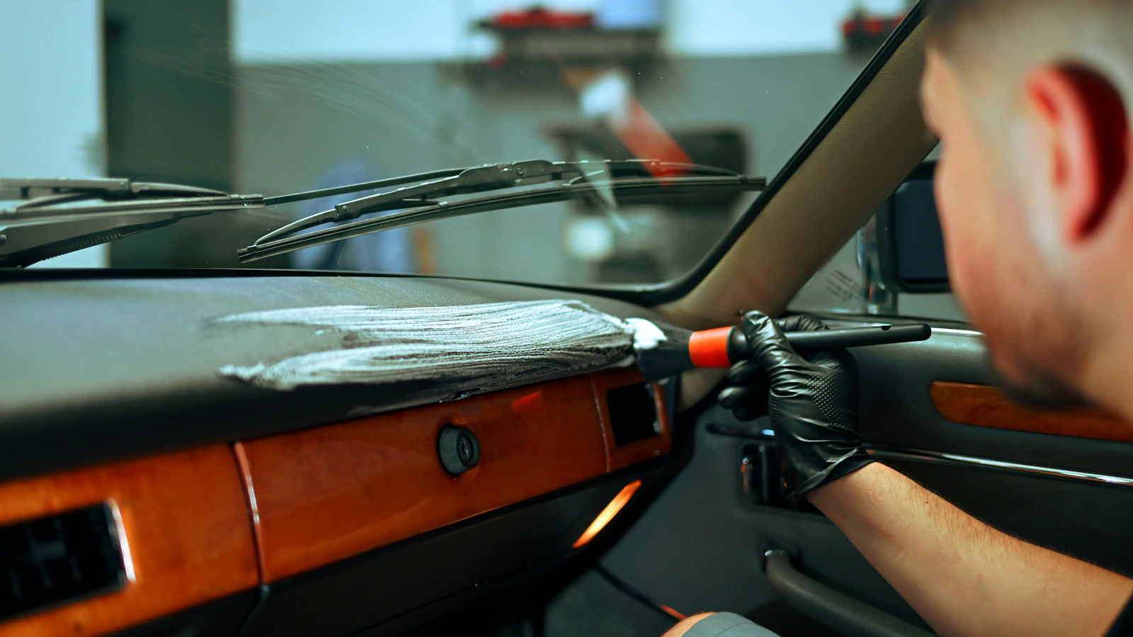 Car interior being carefully cleaned