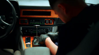 Mechanic working on car's center console