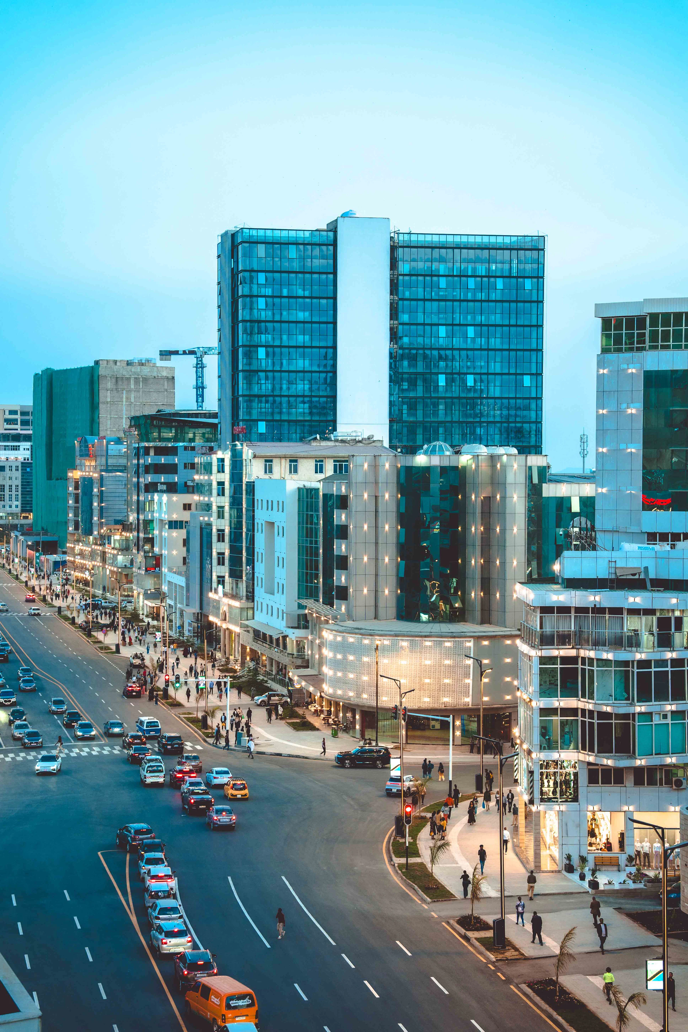 Bustling African city street with modern skyline