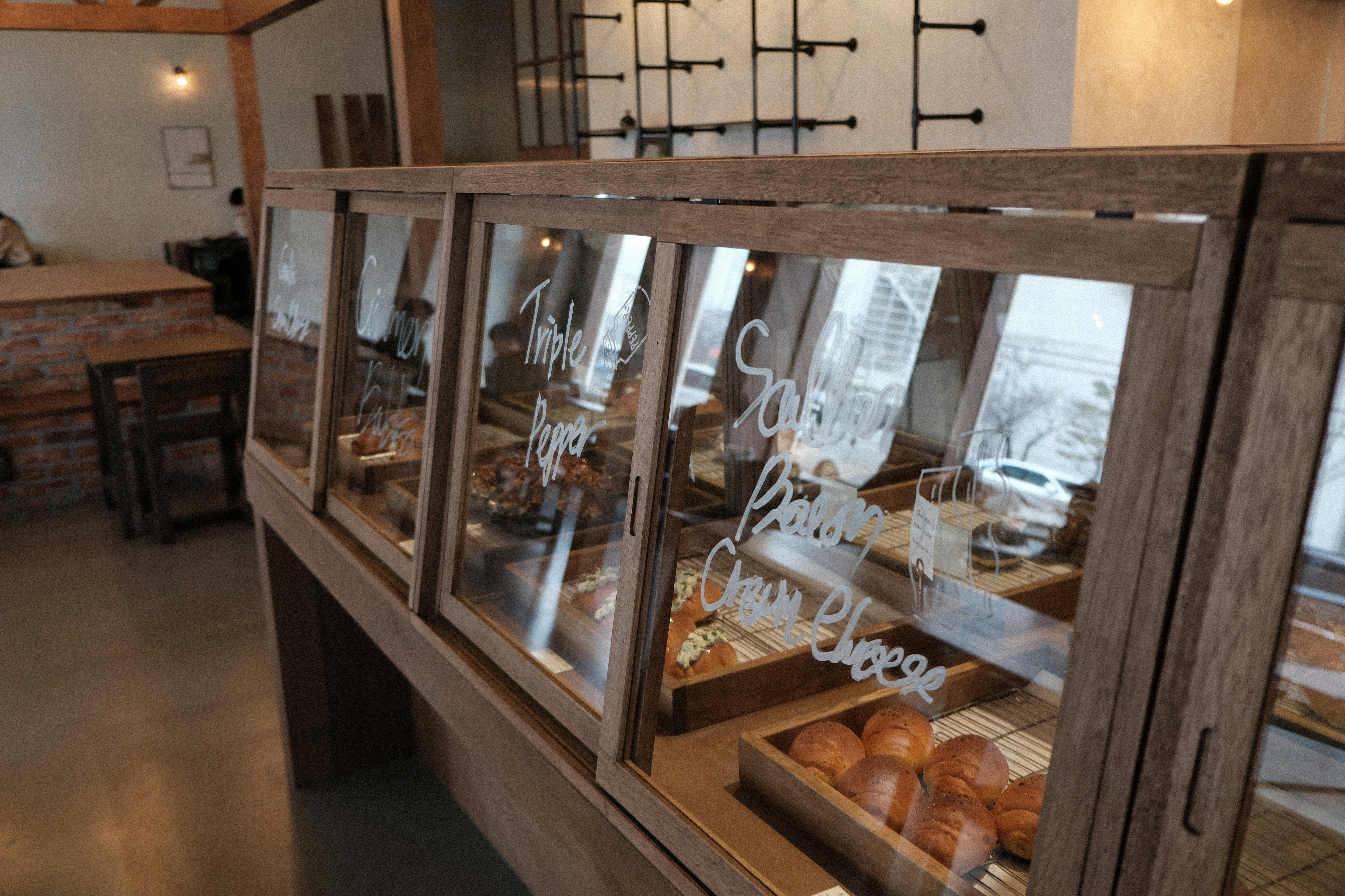 Wooden display case filled with baked goods