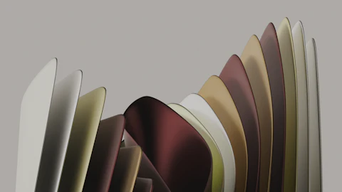 Curved fabric swatches arranged in a row, showing a palette of neutral and warm earth tones