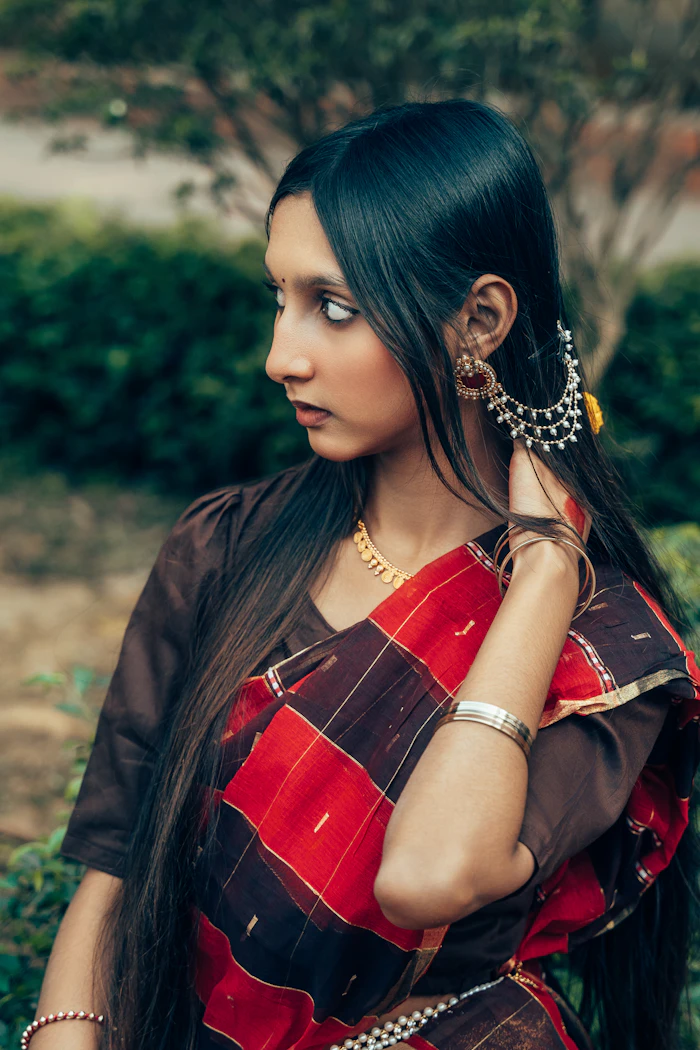 Indian woman wearing an elegant silk saree with traditional jewellery