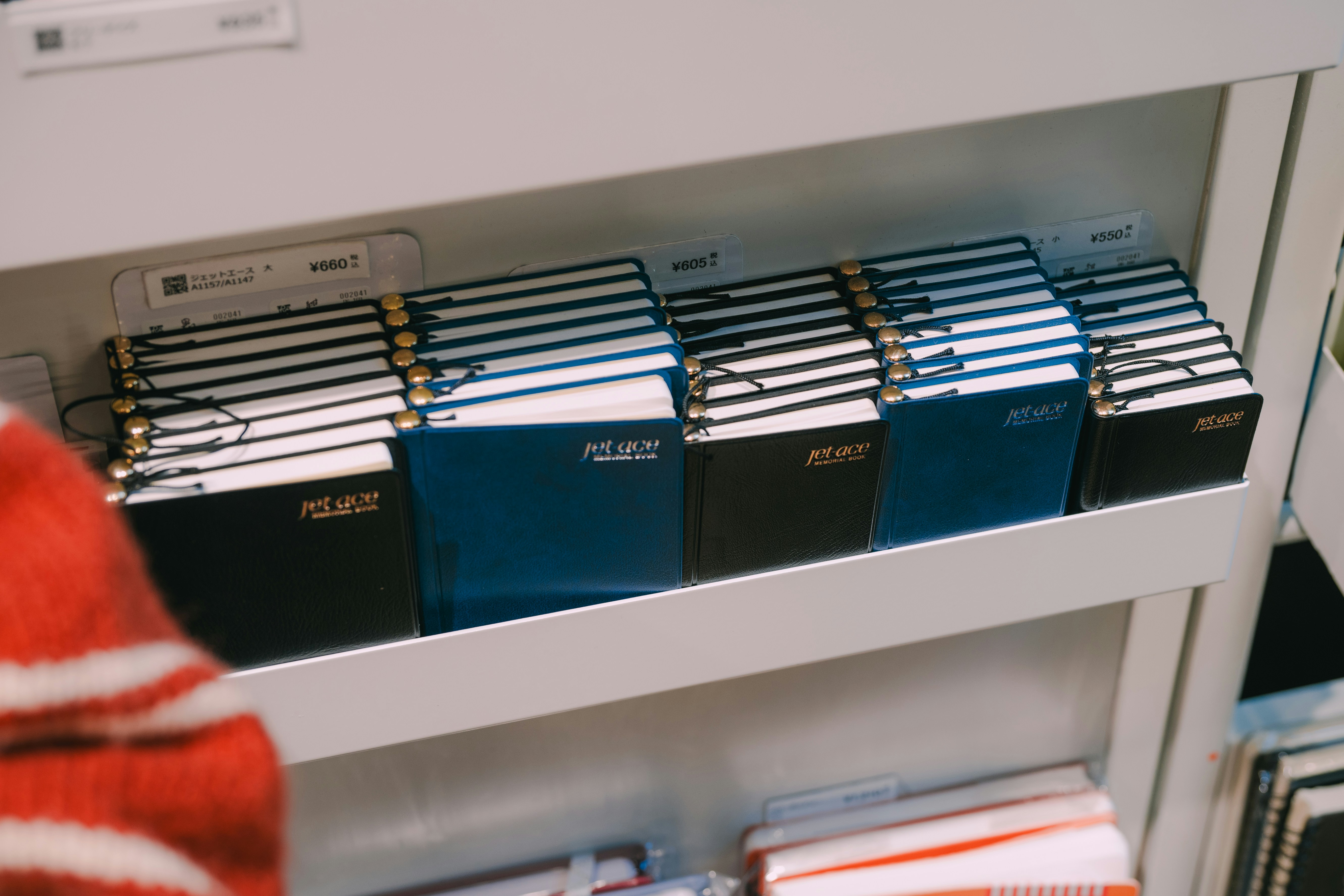 Row of notebooks on a shelf