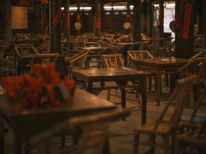 Empty traditional restaurant with wooden tables and chairs