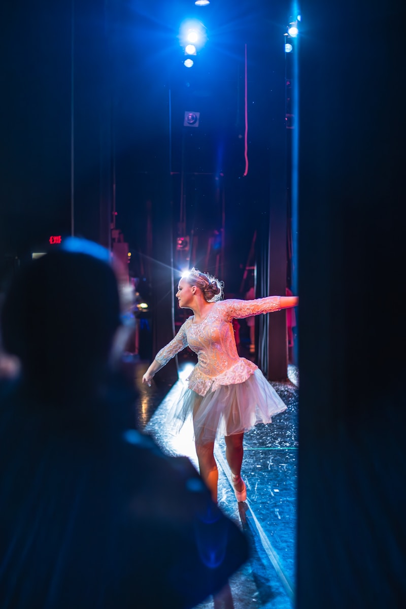 A contemporary dance performance with dramatic lighting