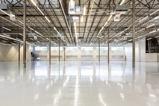 Empty modern warehouse interior with polished concrete floor