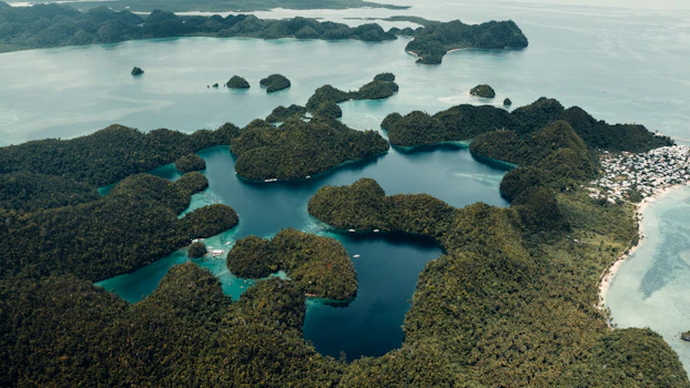 Lush green islands dotting a clear blue ocean
