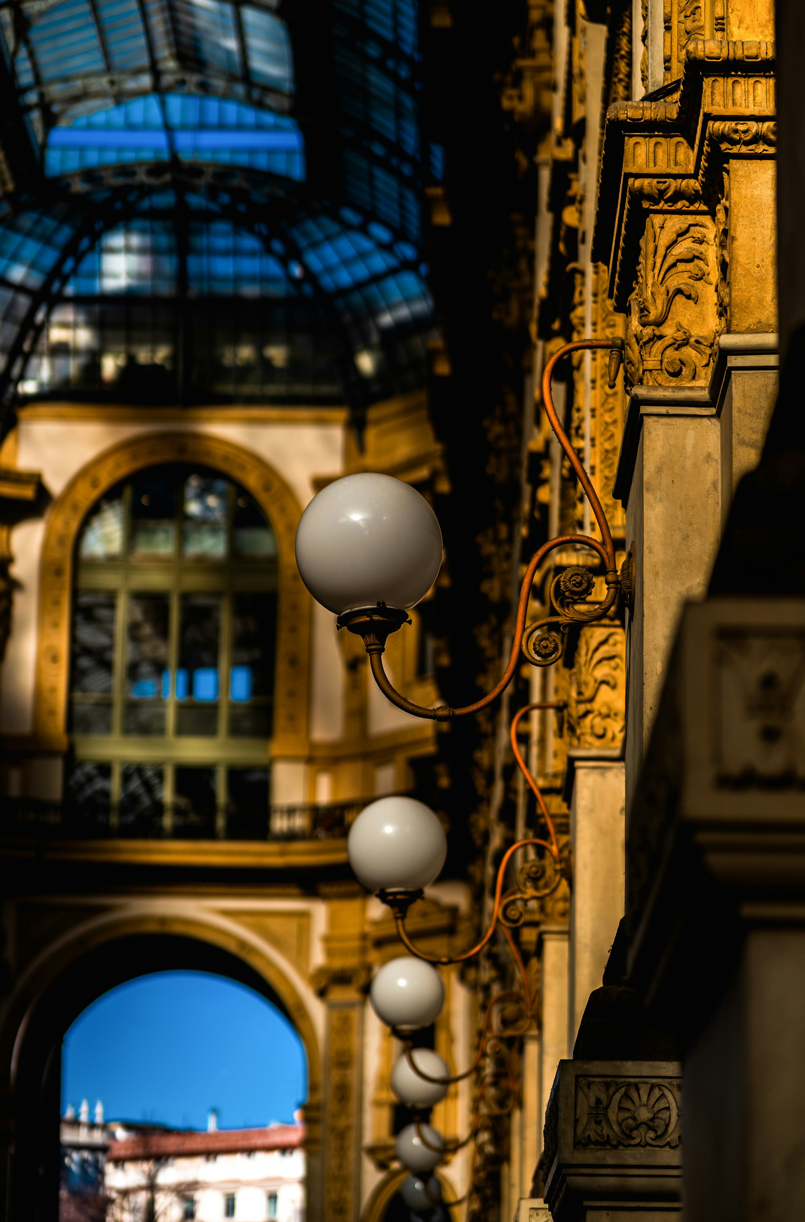Ornate building interior with row of globe lights