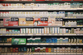 Shelves stocked with various cigarette brands and prices.