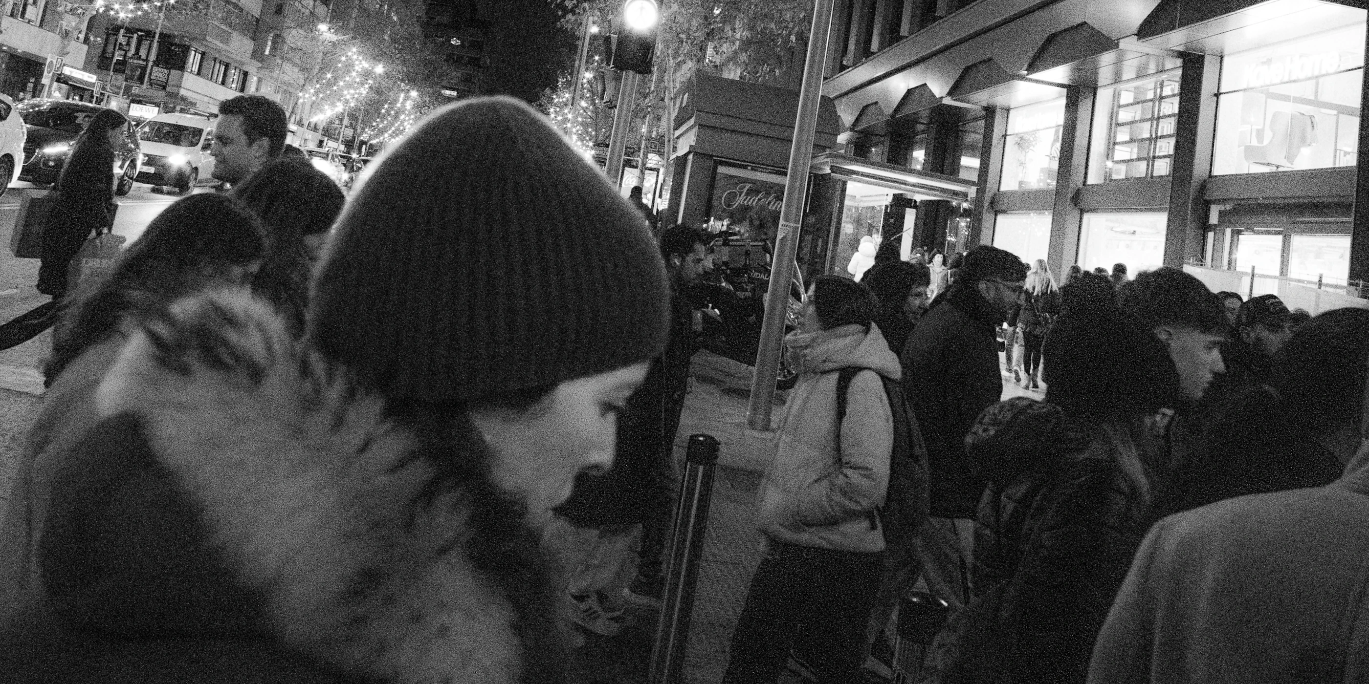 People moving through a city street at night