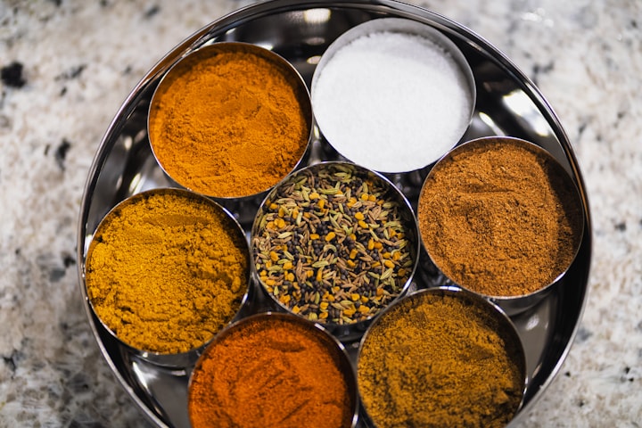 Traditional Indian spice tin with aromatic herbs — the ingredients behind Mother Incense