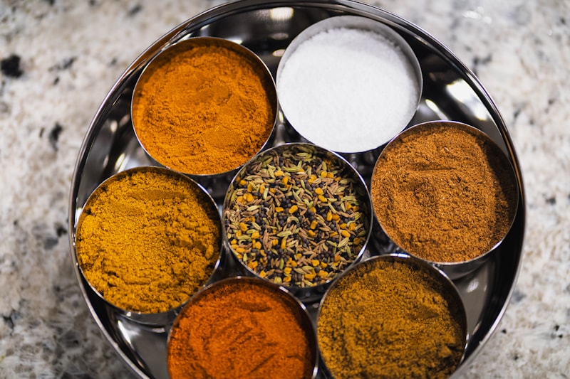 Traditional Indian masala dabba with vibrant spice powders — the heart of Mother Incense, a South Indian kitchen essential