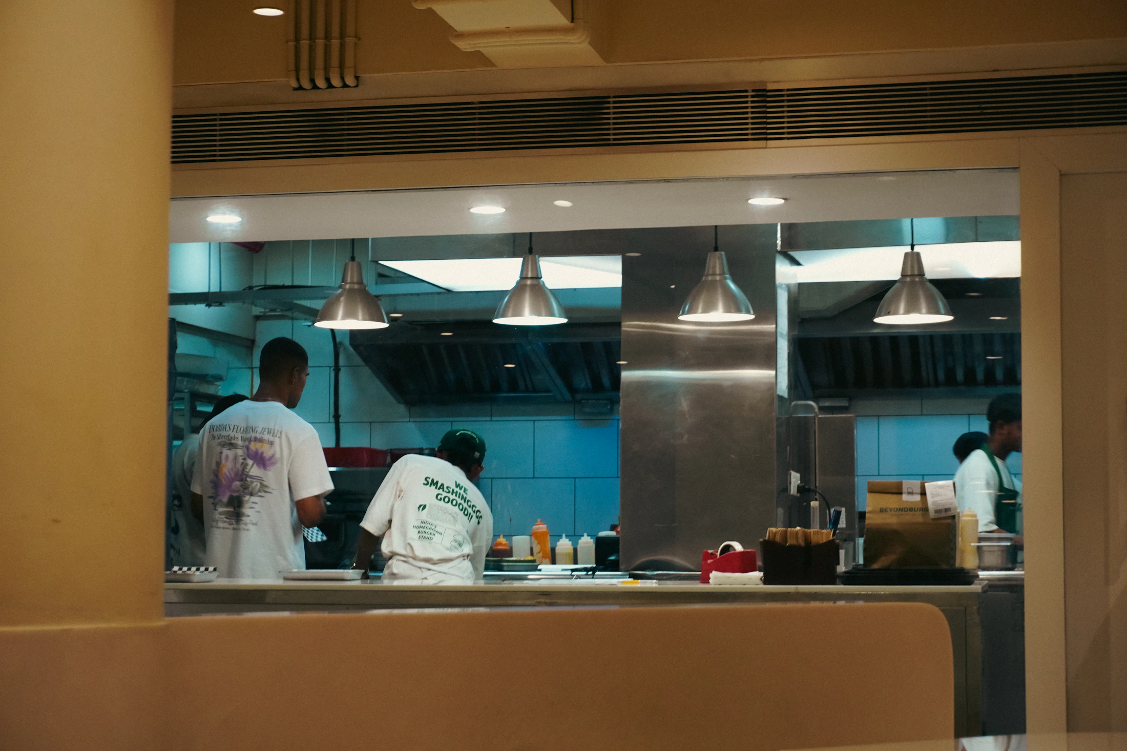 Professional team working inside a commercial kitchen representing ELR kitchen cleaning services