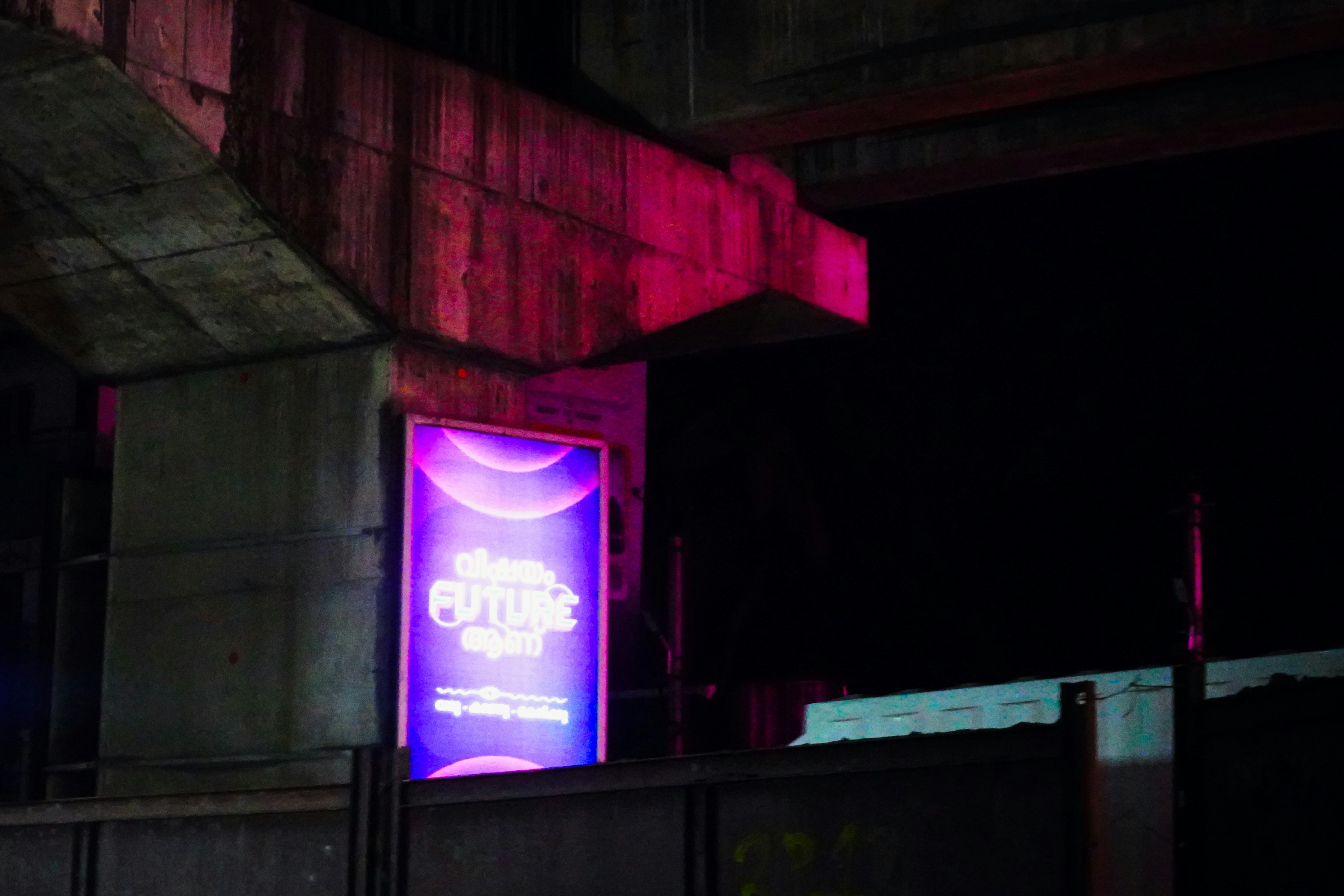 Bright advertisement sign glows at night