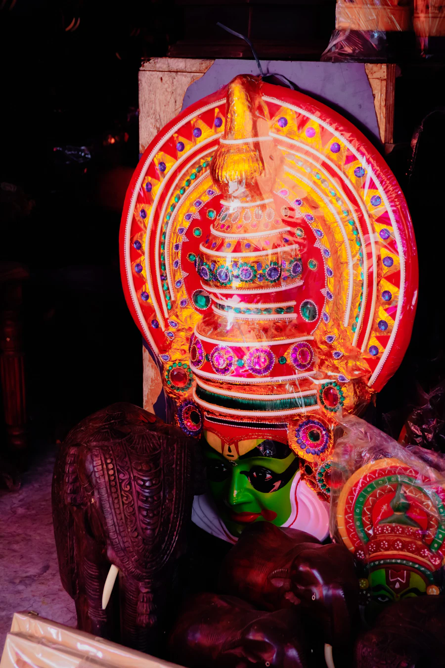 Kathakali mask and wooden elephant