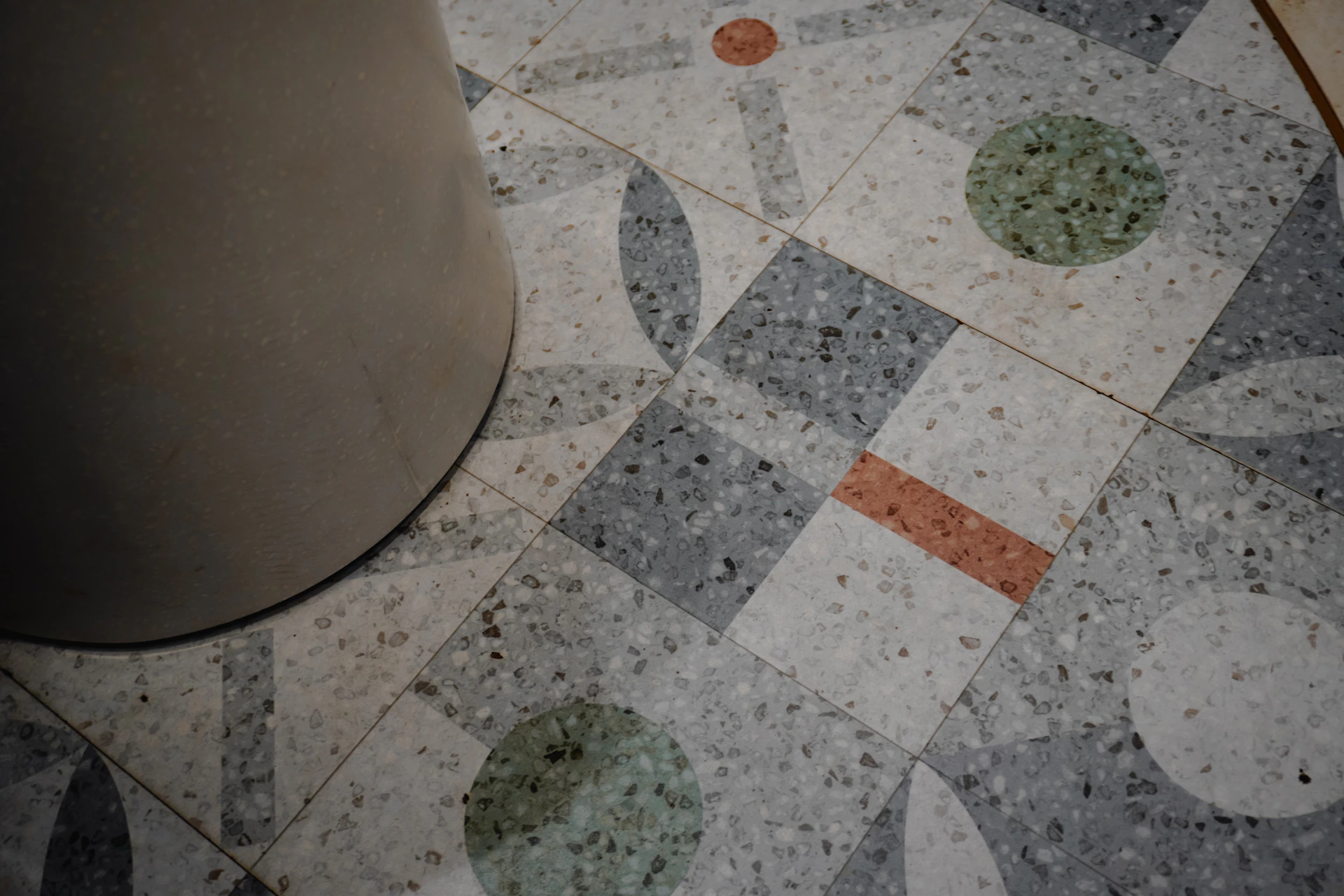A detailed view of a patterned terrazzo floor.