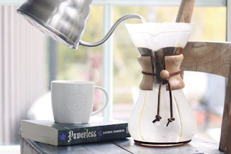 Pouring hot water into a coffee maker