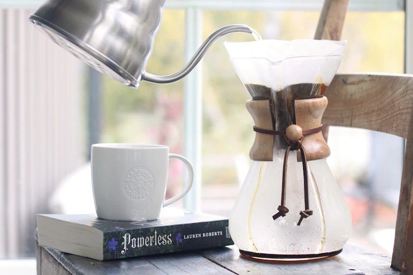 Pouring hot water into a coffee maker