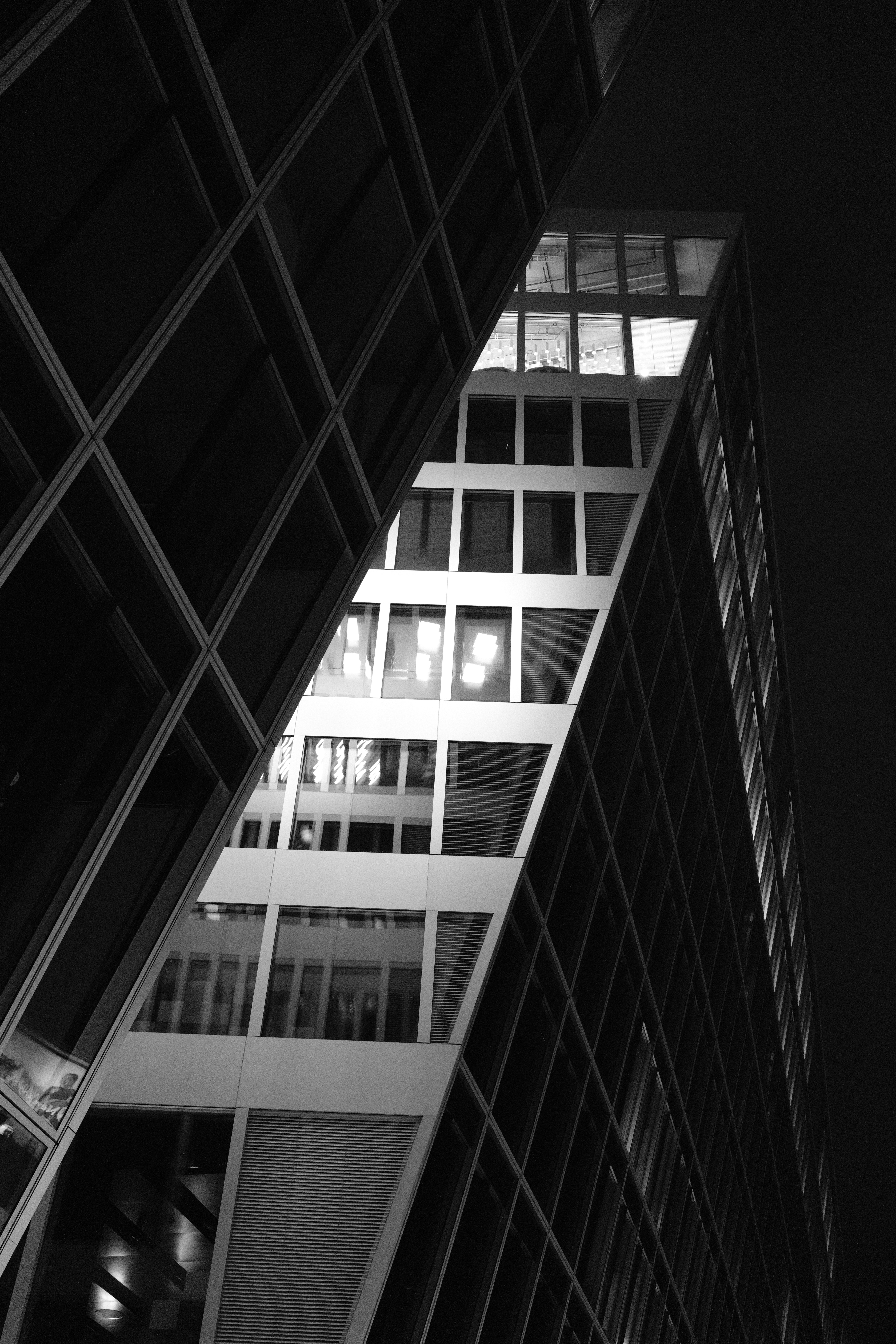Modern skyscrapers with illuminated windows at night