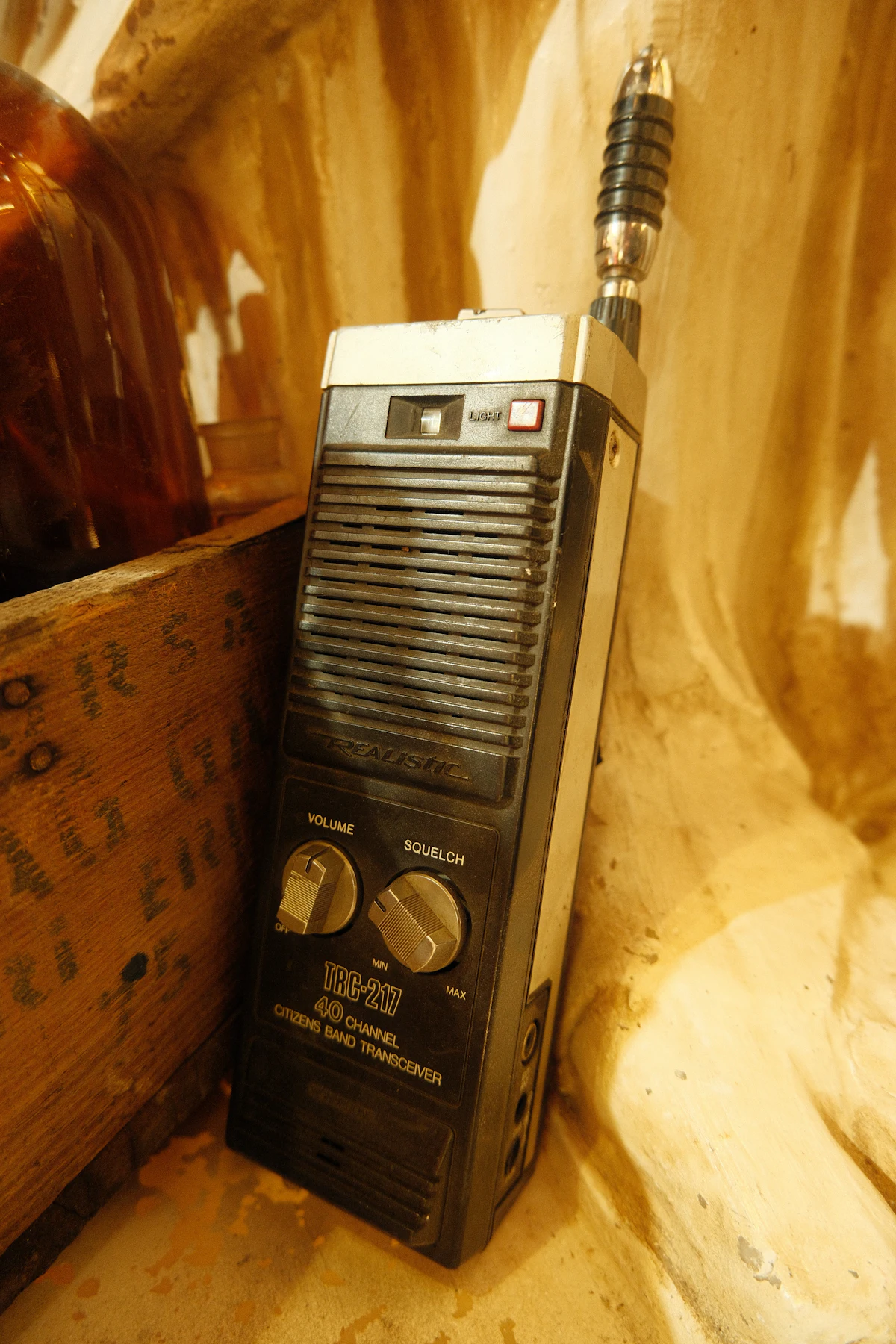 Vintage CB walkie-talkie radio with antenna and control knobs