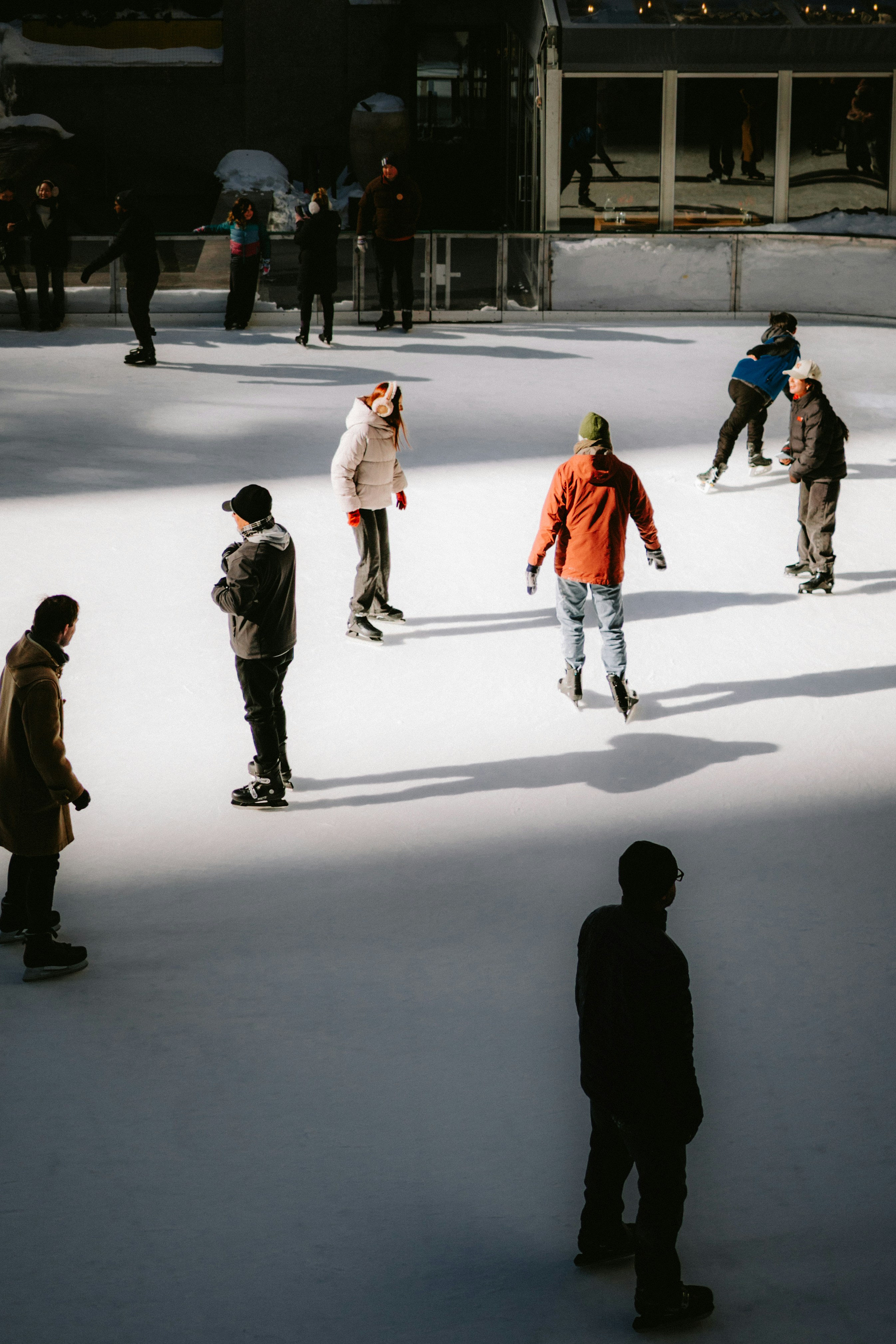 People ice skating on an outdoor rink
