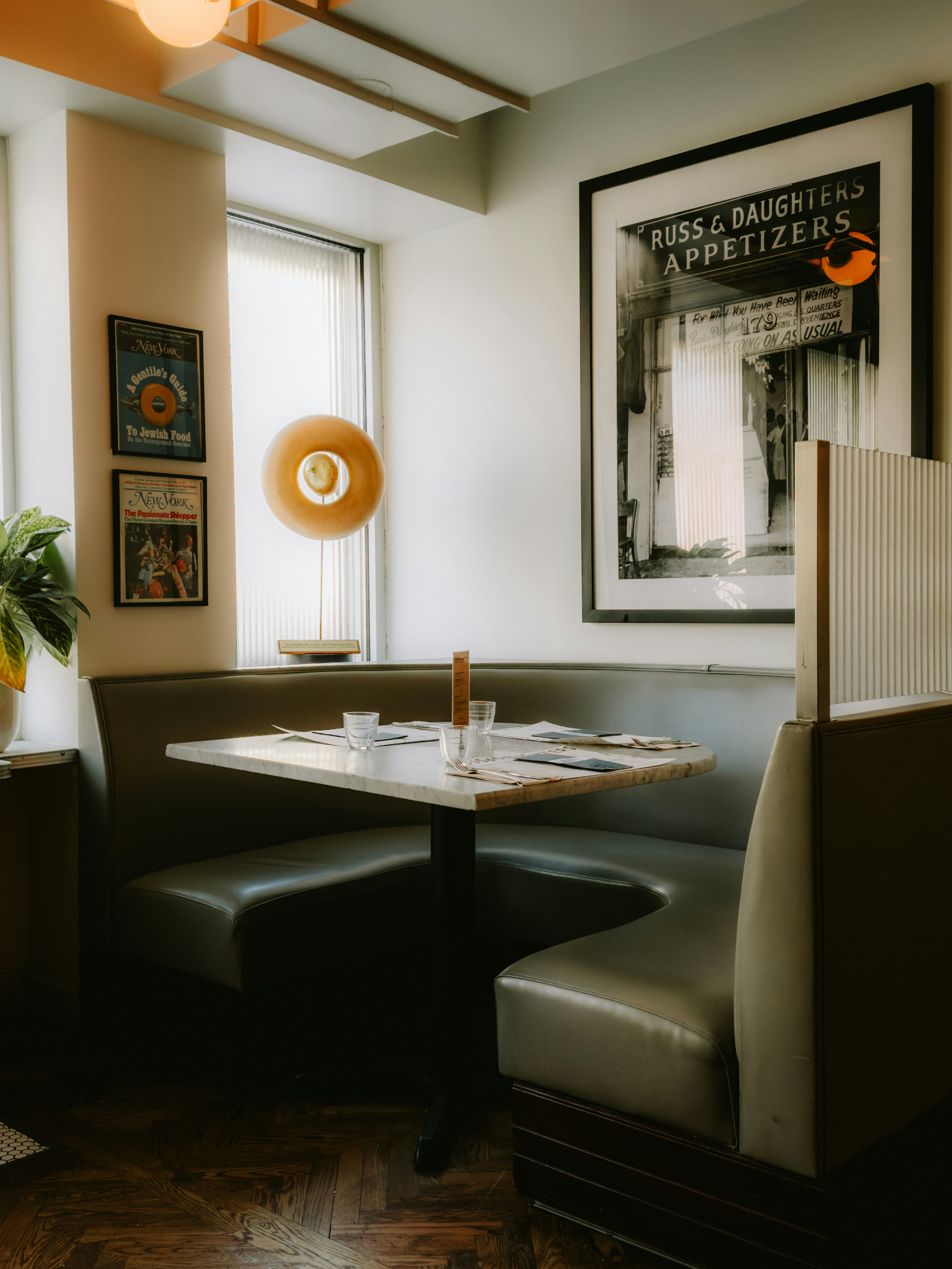Restaurant booth with a table set for dining.
