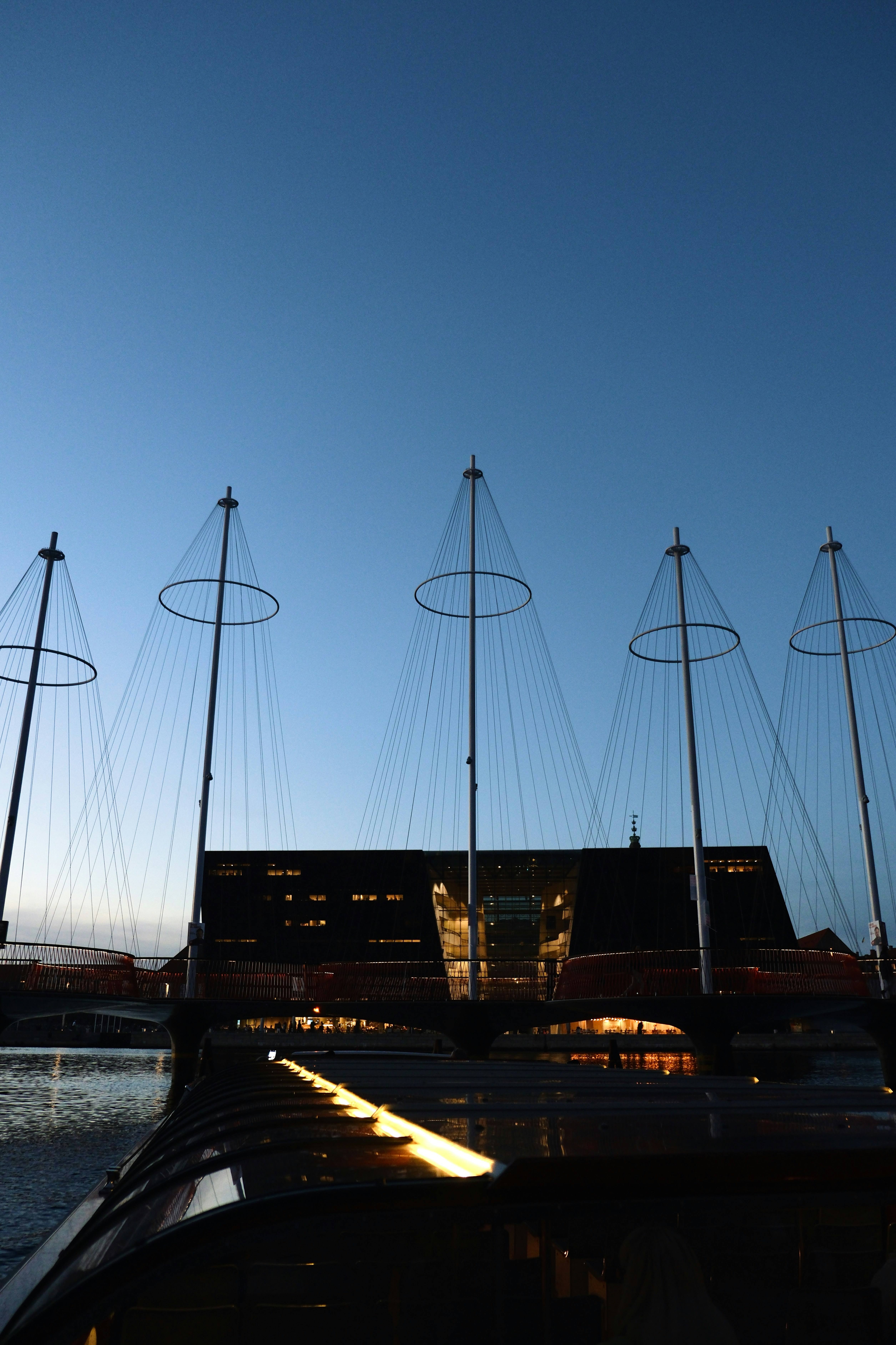 Modern building with circular sculptures against blue sky