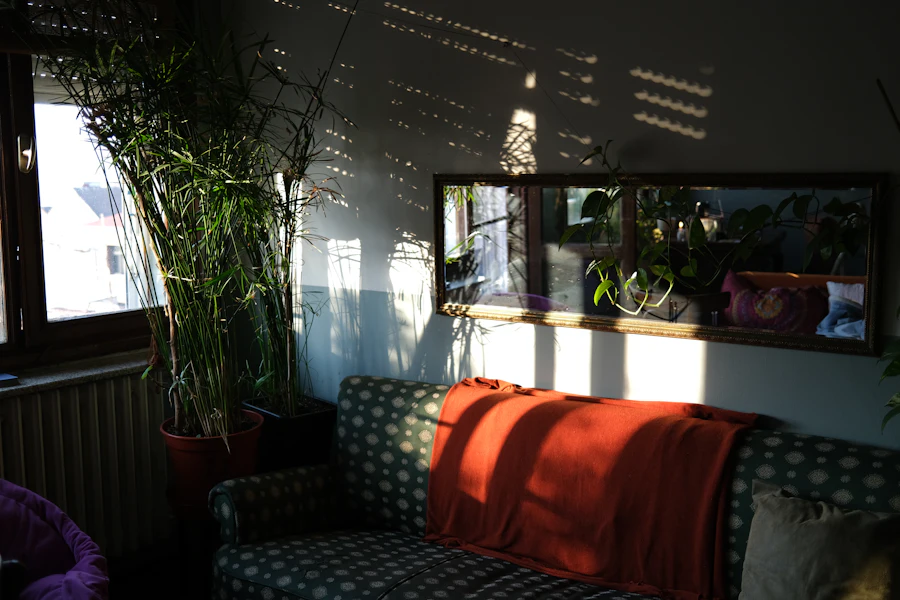 Striped sunlight through blinds falling on a quiet sofa