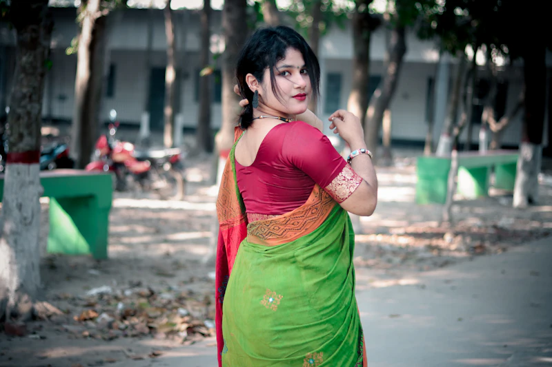 Graceful Indian sugar mama in a green and red sari