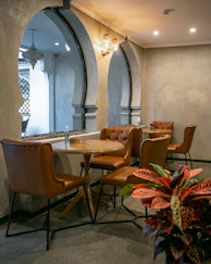 Cozy cafe interior with leather chairs and round tables