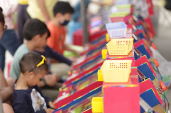 Children playing at colorful game booths
