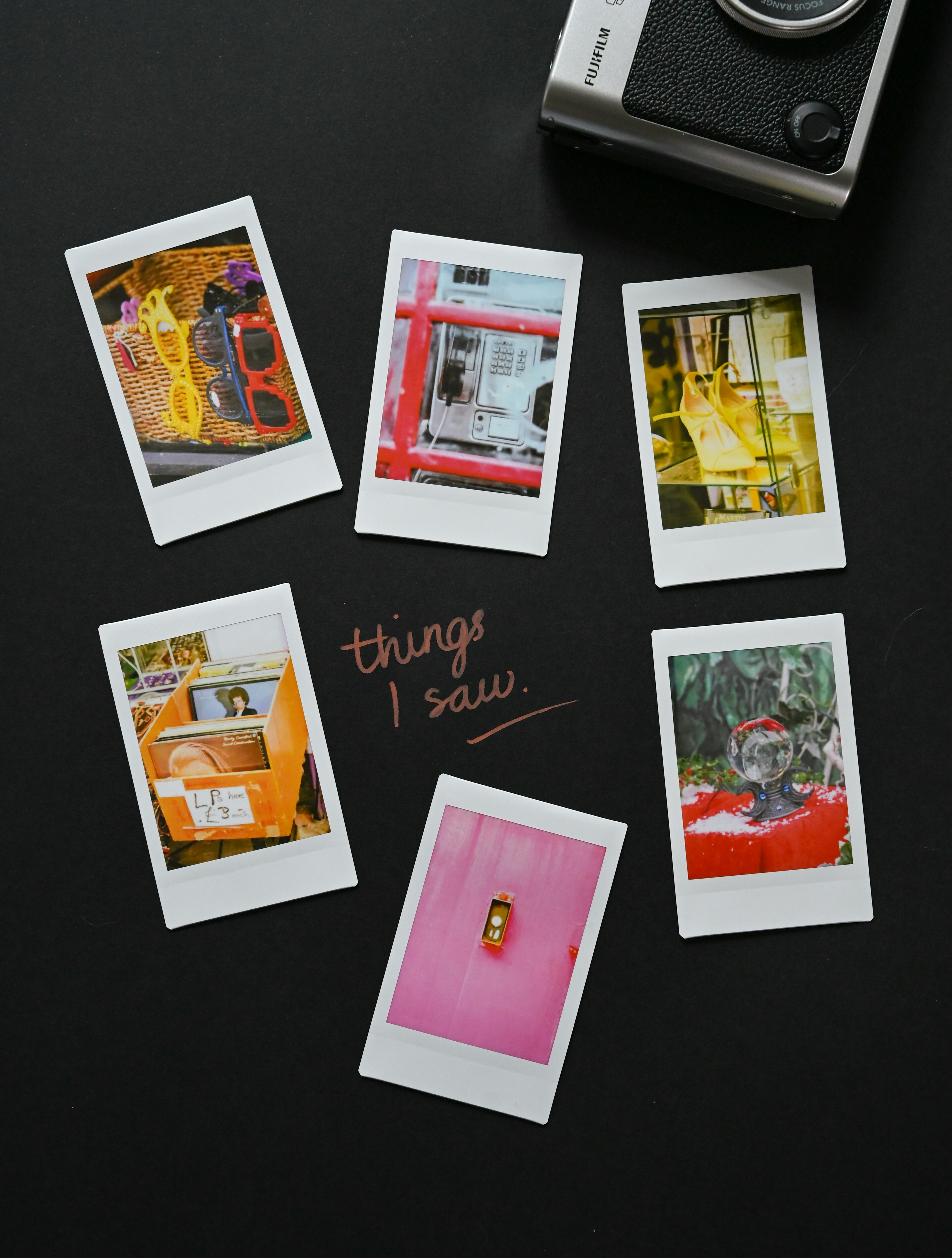 Instant photos arranged with a vintage camera