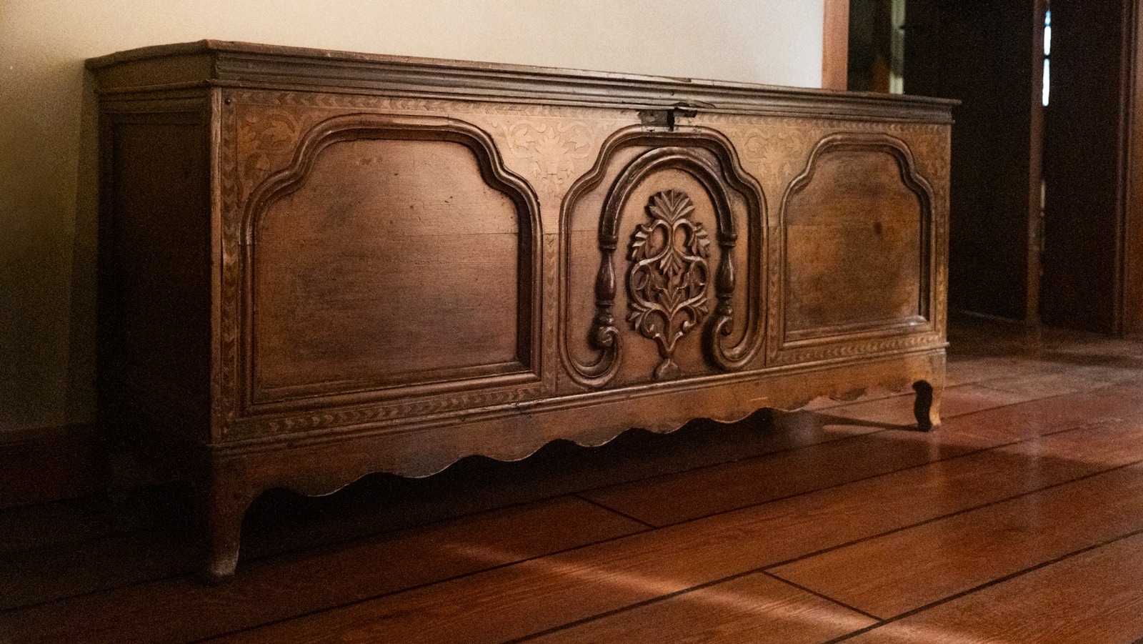 antique carved wooden chest used for bedroom storage