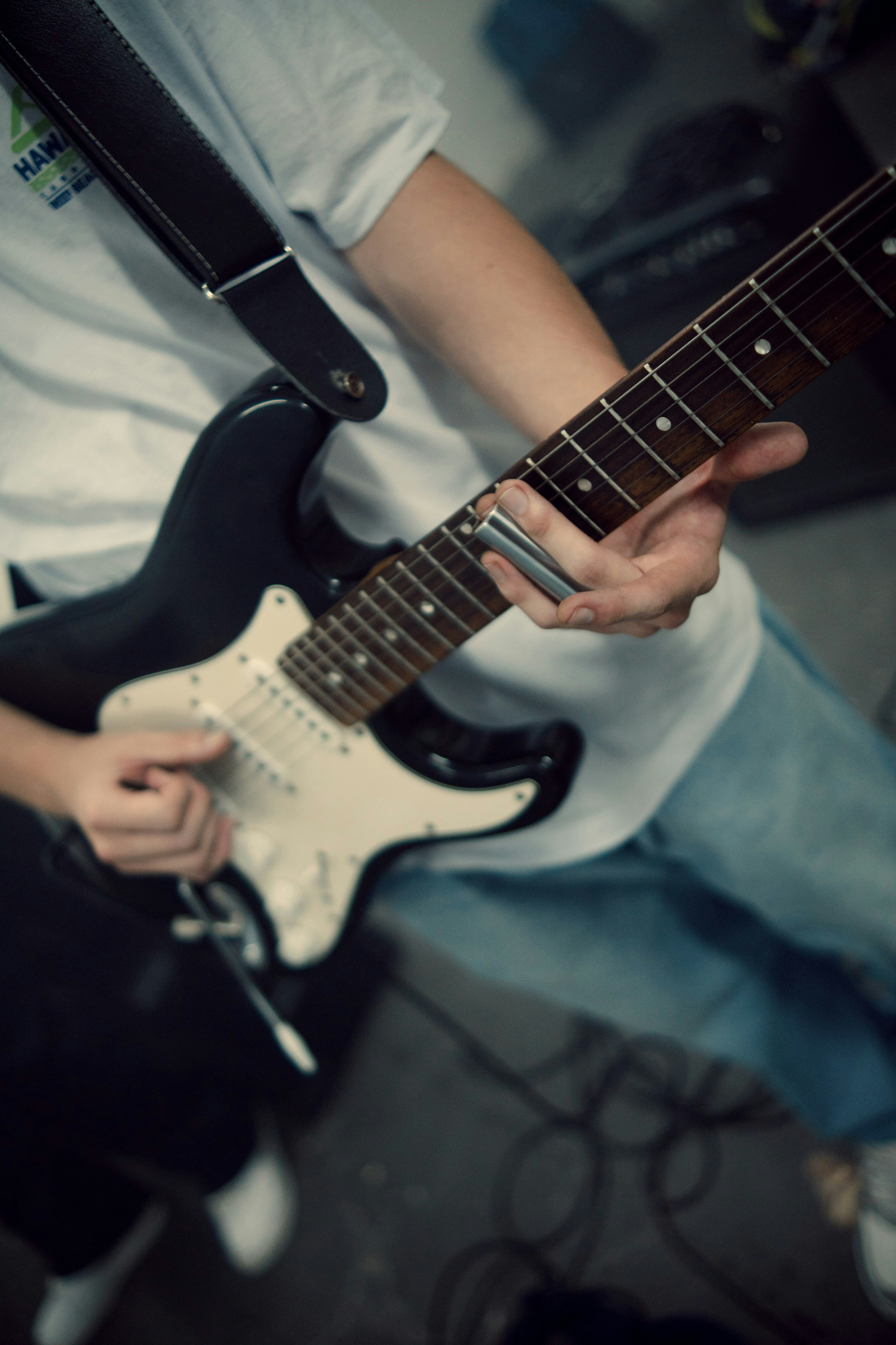 Beginner student learning guitar during a one-on-one lesson in St Leonards on the North Shore