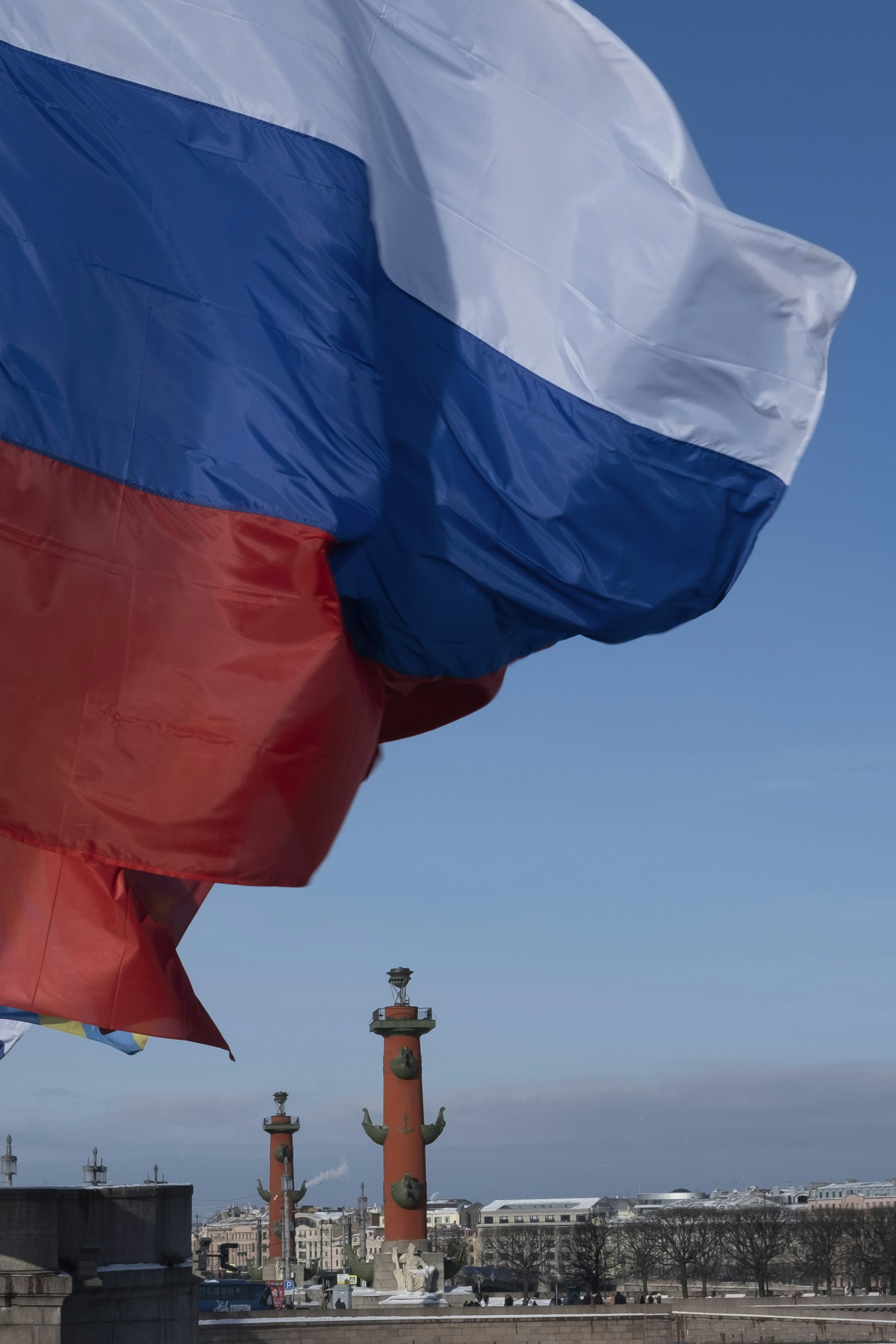 Russian flag waving with rostral columns in background