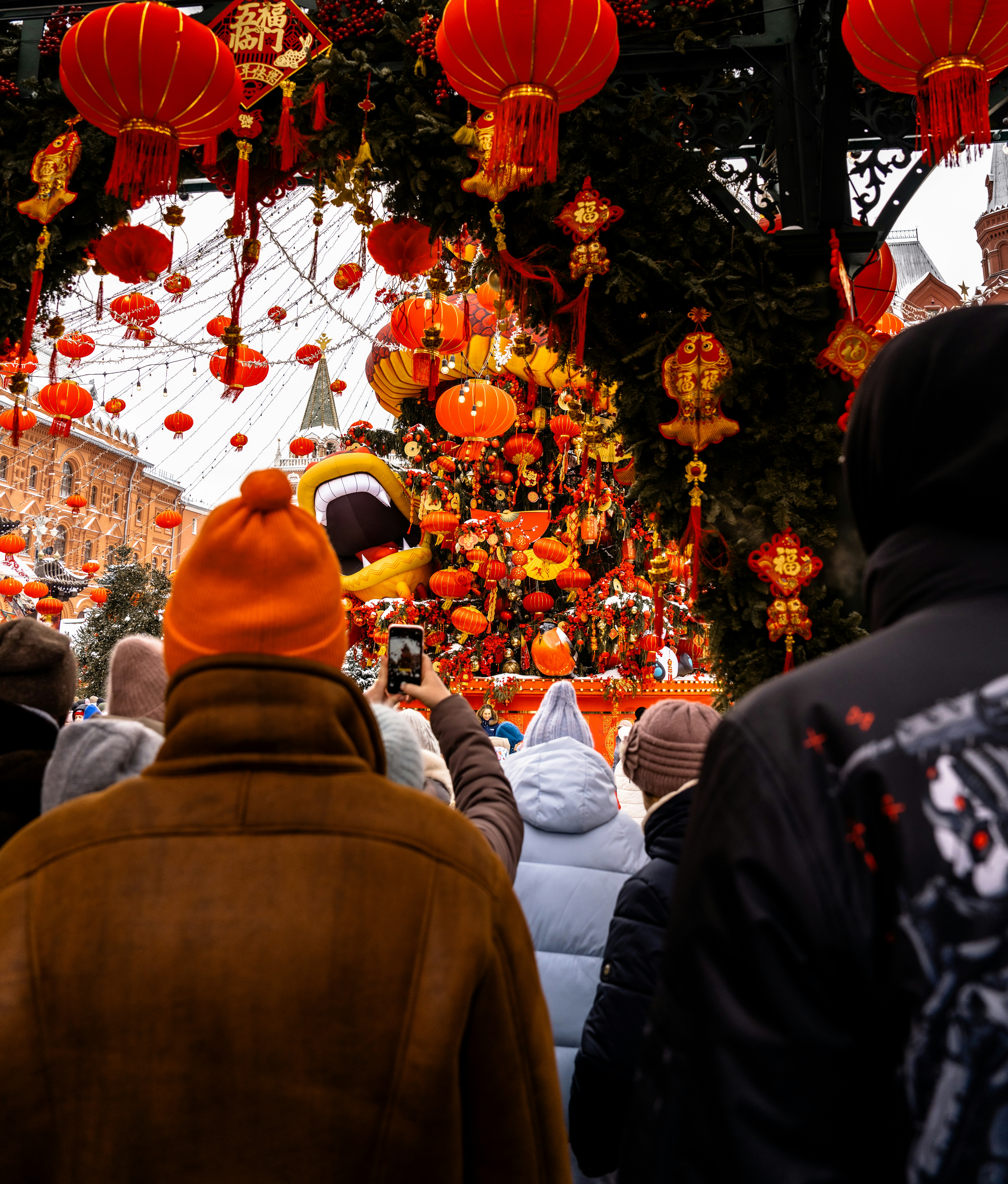 People watch a lion dance during a festival.