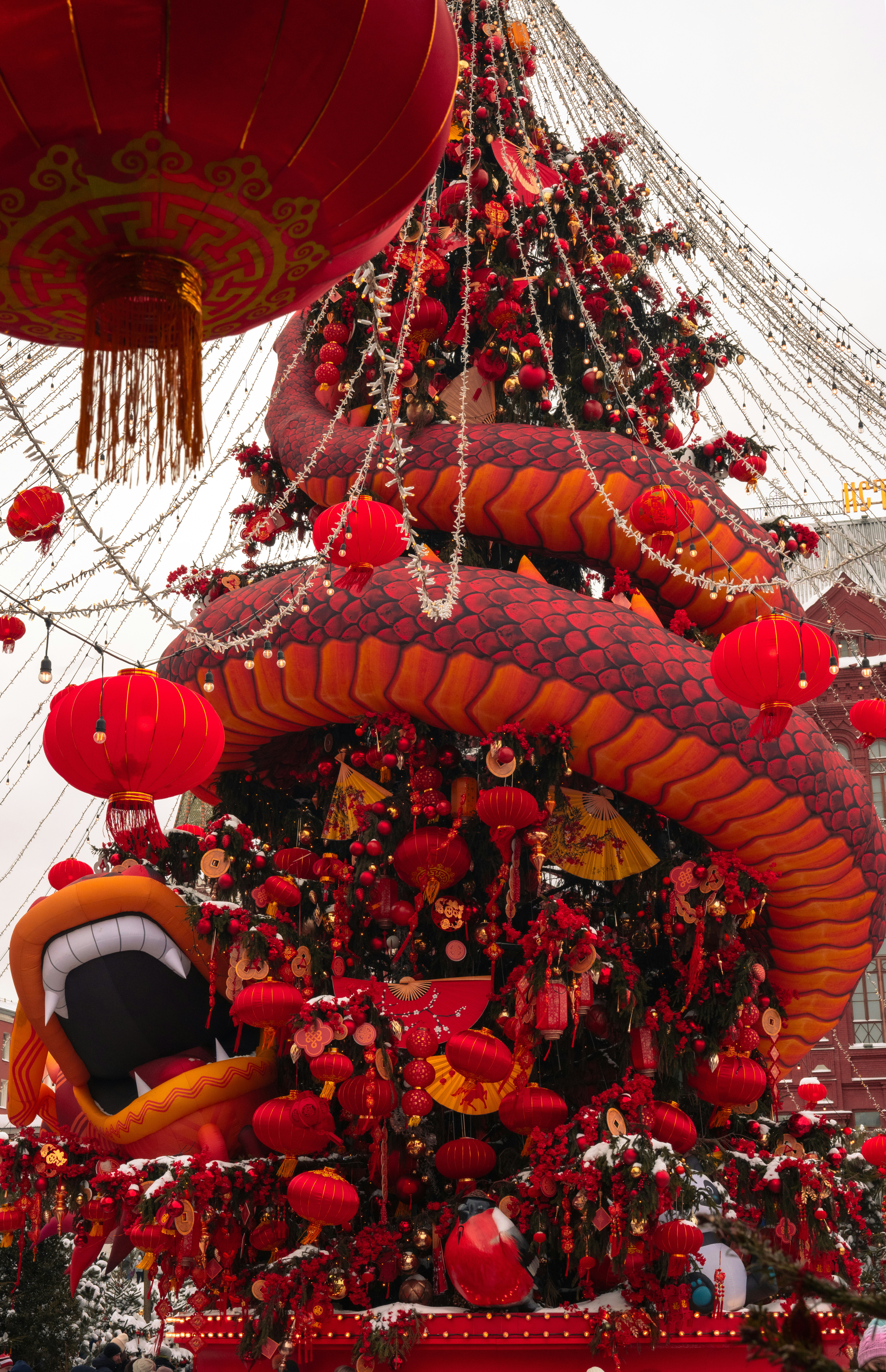 A dragon-shaped decoration with red lanterns