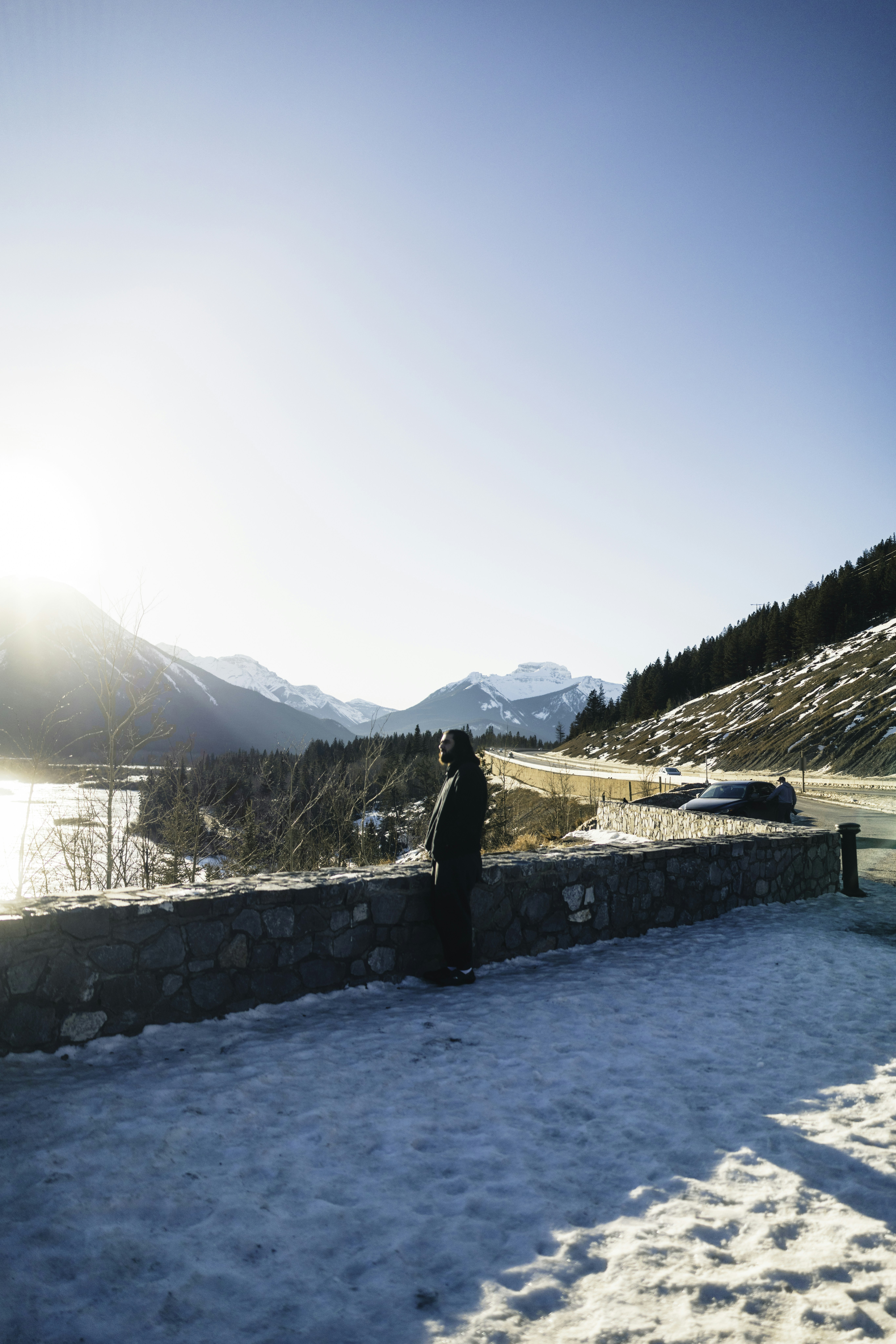Person looking at a snowy mountain landscape