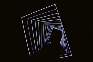 Abstract geometric tunnel with white lines on black