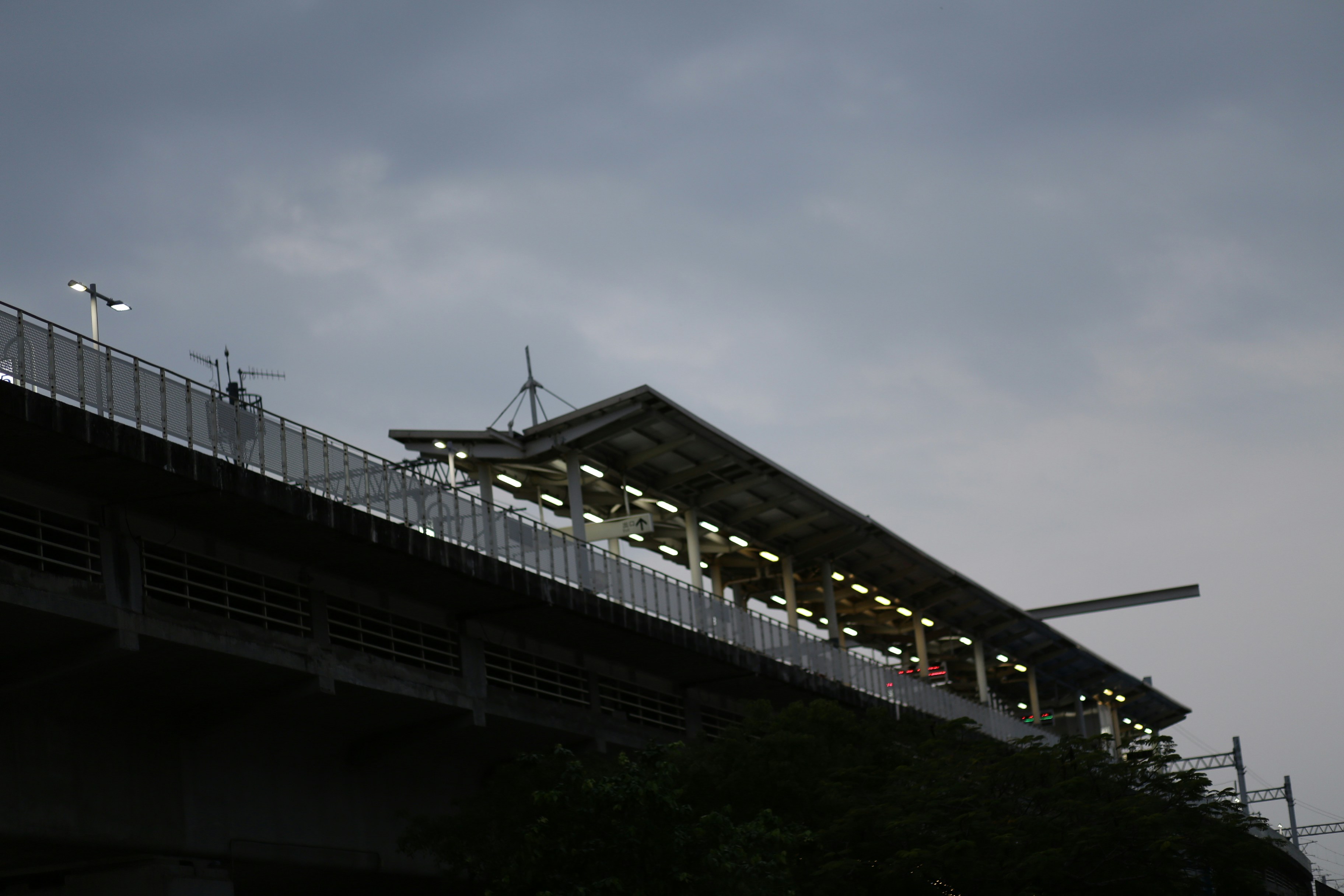 Elevated train station platform at dusk