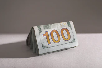 A stack of one hundred dollar bills