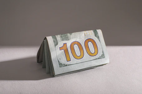 A stack of one hundred dollar bills