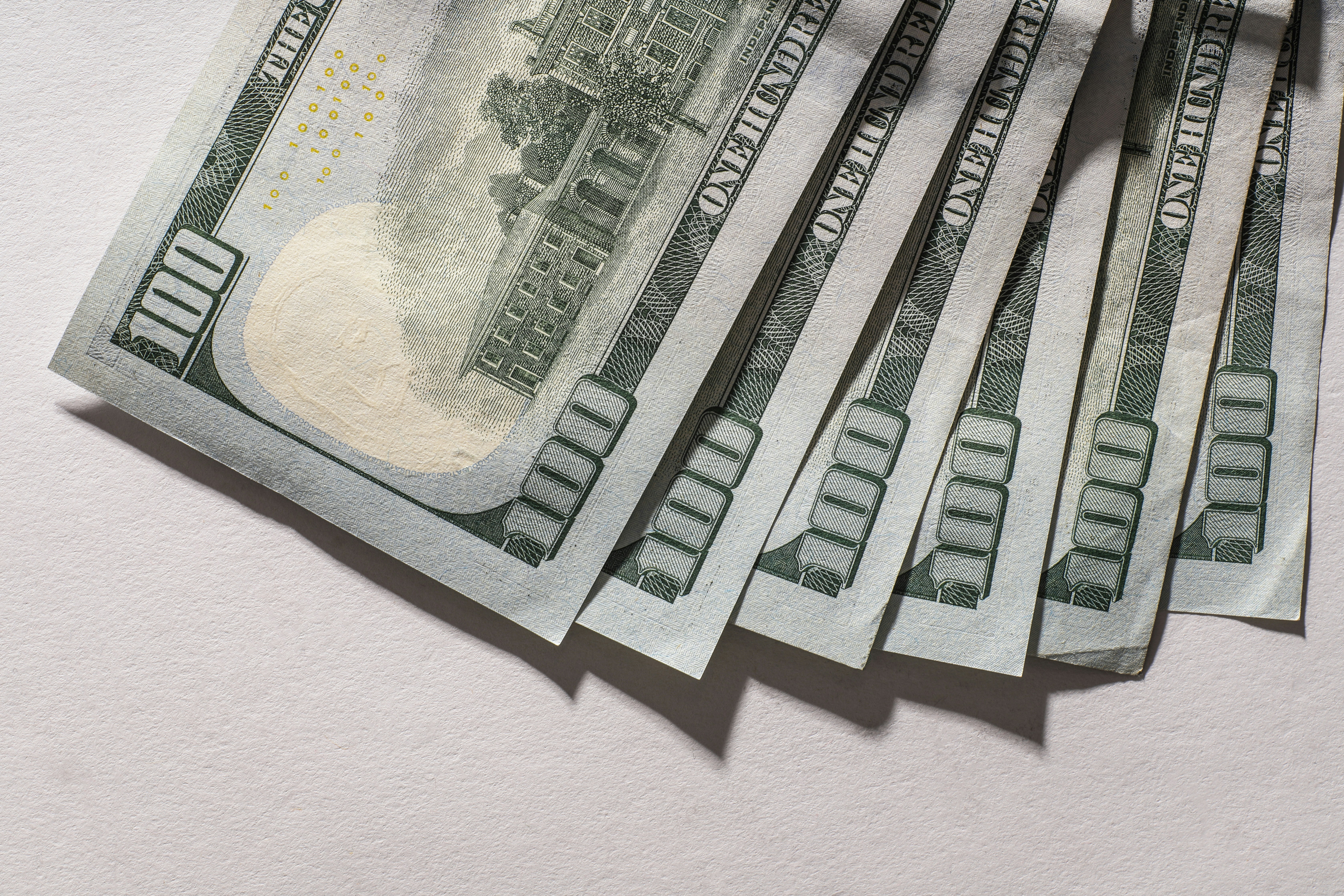 Several us hundred dollar bills fanned out