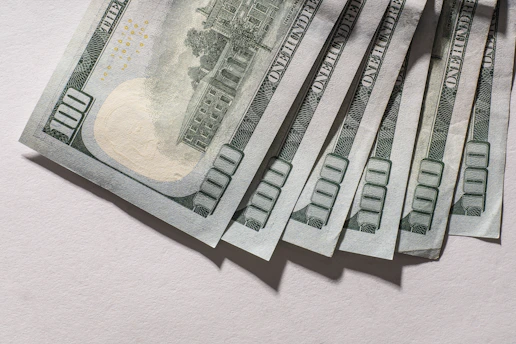 Several us hundred dollar bills fanned out