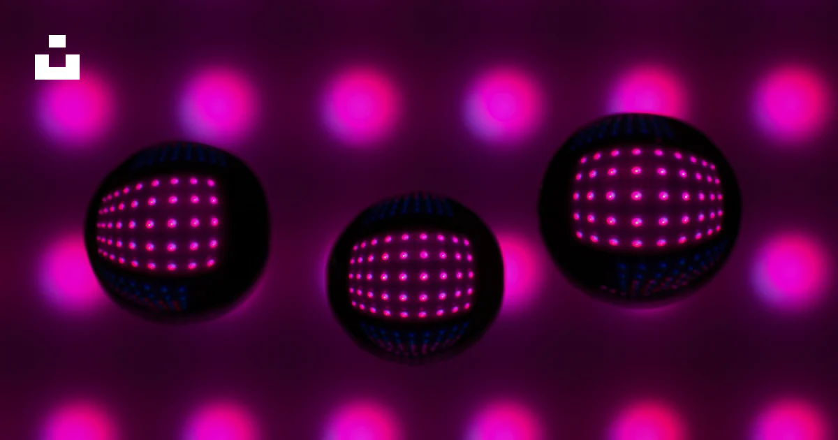 Pink Reflecting Screen Three dark spheres reflecting pink lights on a pink background. photo ...